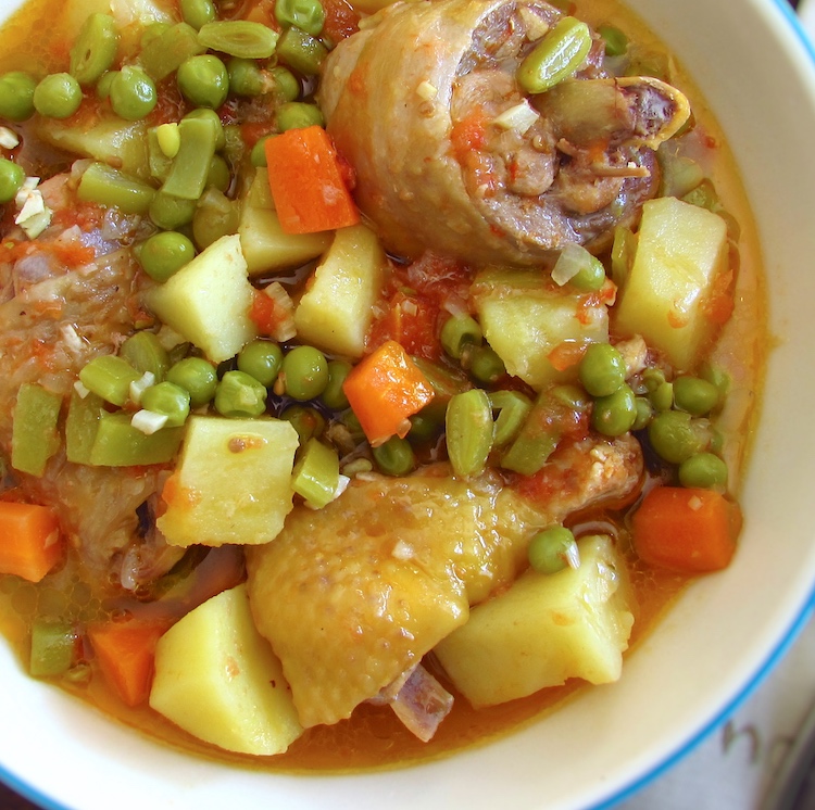 Hearty chicken stew on a dish bowl