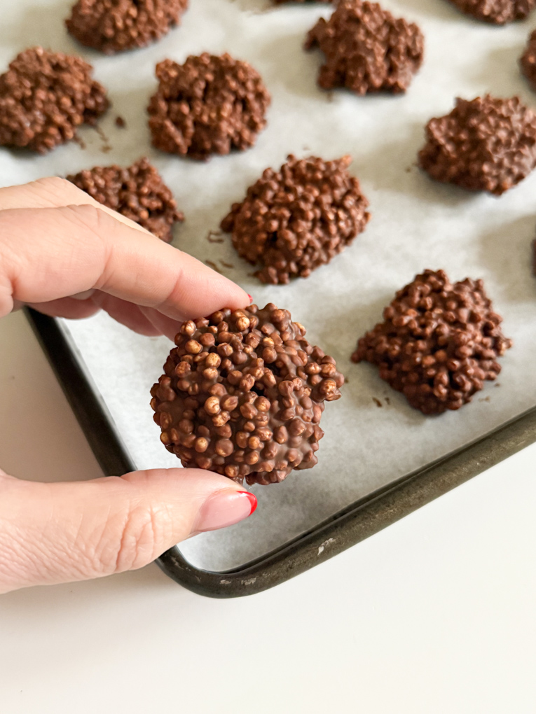 Chocolate Quinoa bites on a baking tray lined with grease proof paper.