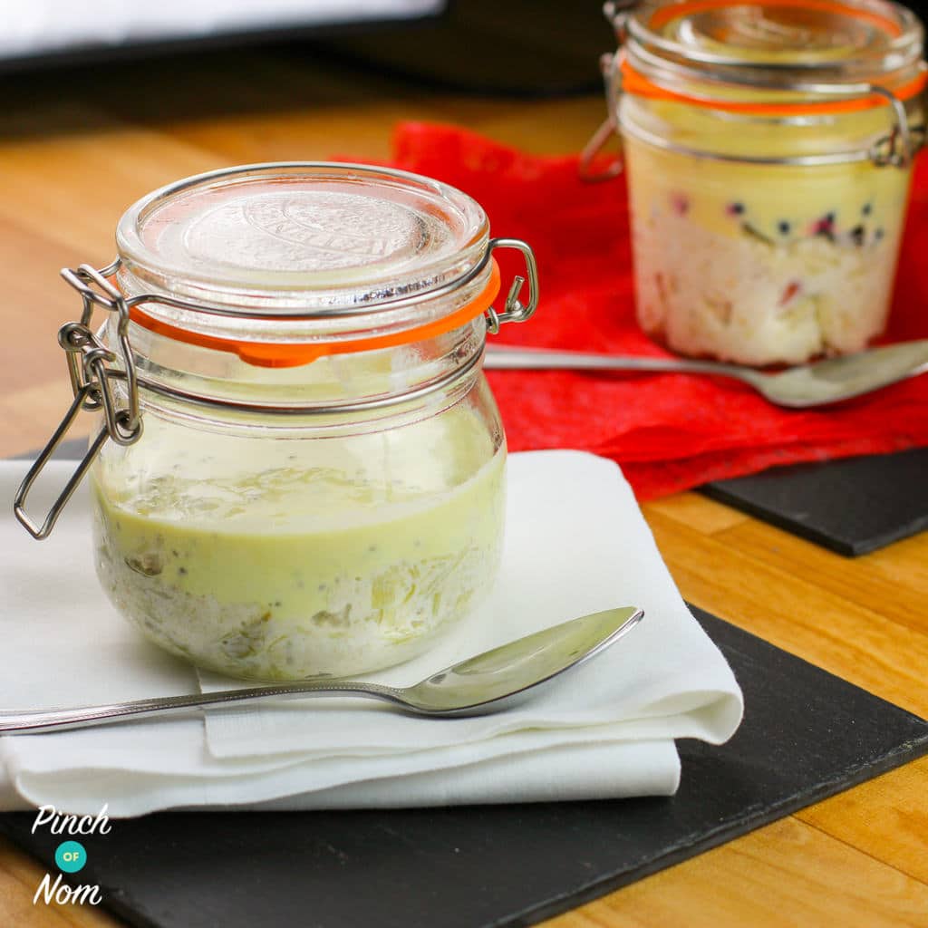 Pinch of Nom's slimming-friendly Rhubarb and Custard Overnight Oats recipe is served in a mason jar, ready to enjoy.