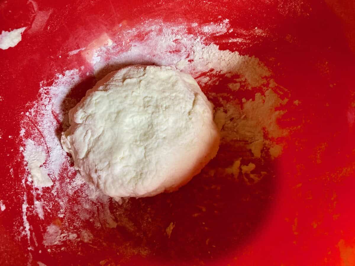 2-ingredient dough in red bowl.
